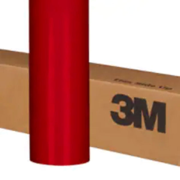 Red vinyl wrap roll with 3M branding on a cardboard box