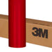 Red vinyl wrap roll with 3M branding on a cardboard box