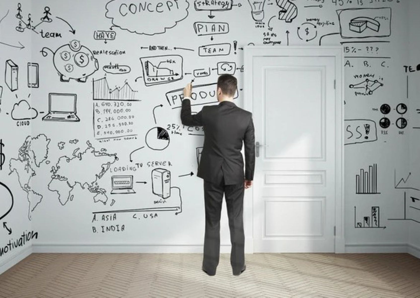Man in a suit standing in front of a whiteboard with various diagrams and notes.