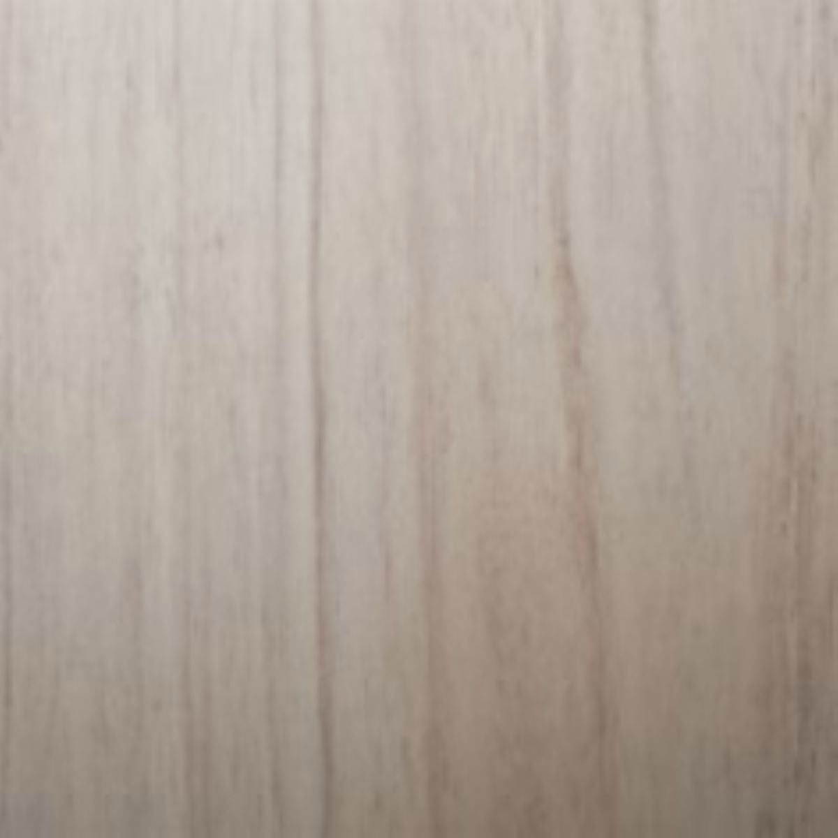 Close-up of a wooden surface with a light brown color and visible grain pattern.