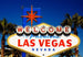 Welcome to Las Vegas sign with palm trees against a blue sky