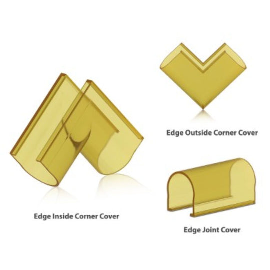 Three gold corner and joint covers on a white background