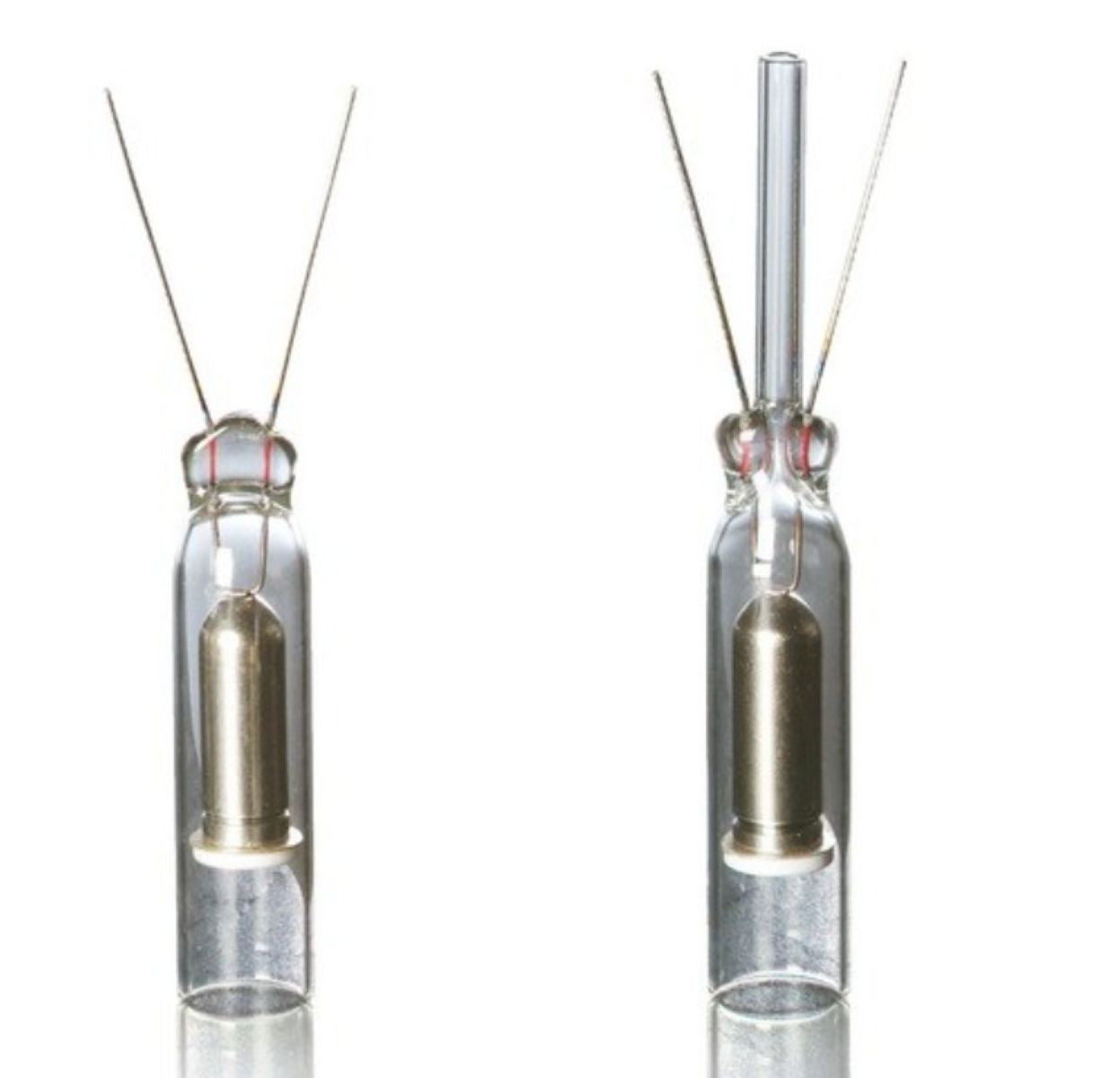 Two glass vials with metal components on a white background