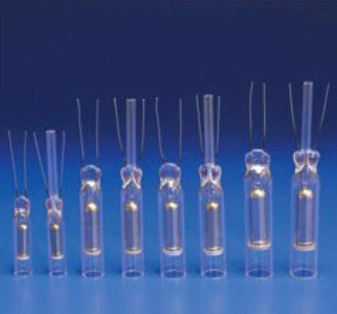 Set of clear plastic syringes with needles on a blue background