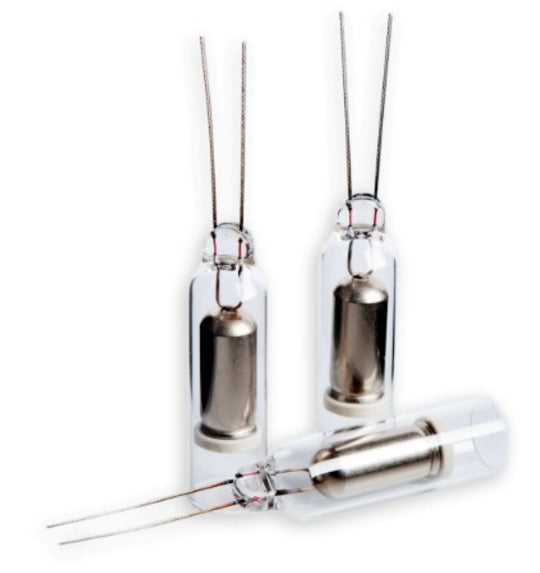 Three glass ampoules with metal capsules on a white background