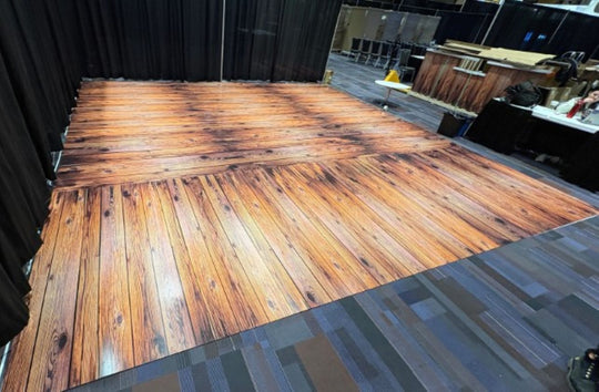 Wooden stage with a black curtain background