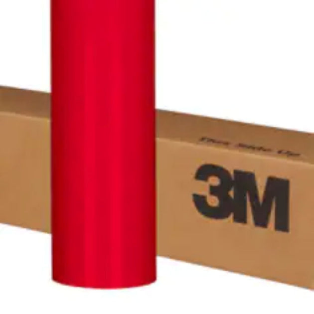 Red 3M vinyl wrap roll on a cardboard box with '3M' branding.