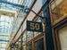 Building facade with a sign displaying the number 50 in an indoor setting with glass ceiling