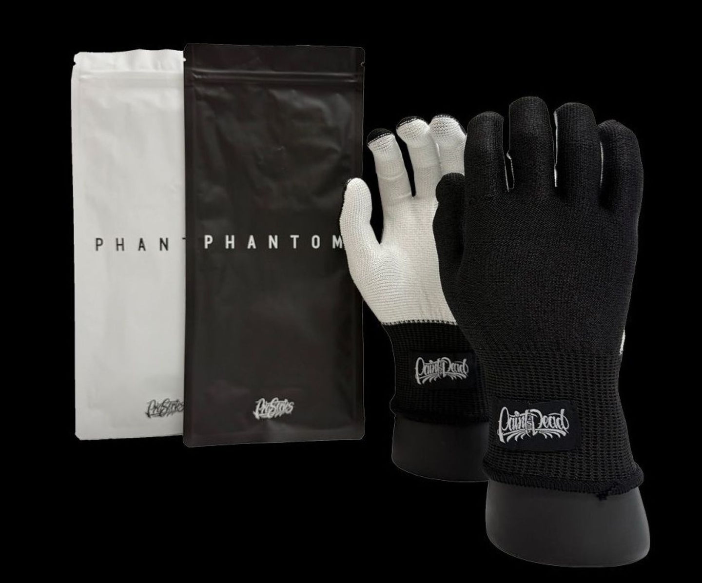 Black and white gloves with 'Capital D' branding on a black background