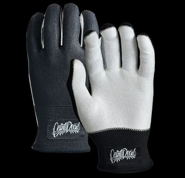 Pair of black and gray gloves with 'Cruel Dead' branding on a clear background