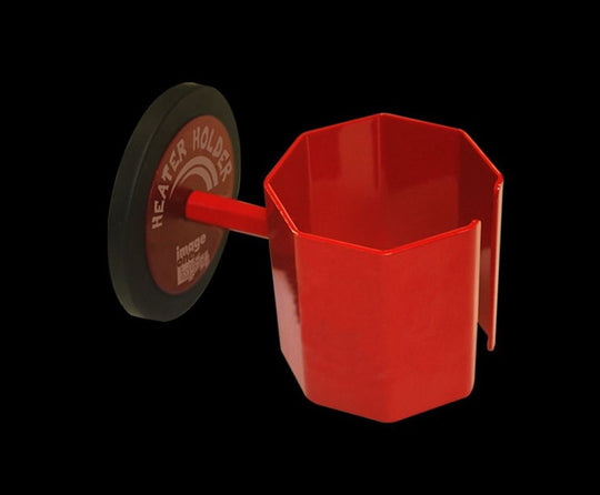 Red plastic heater holder on a black background