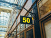 Building exterior with a sign displaying the number 50