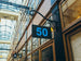 Building exterior with a sign displaying the number 50