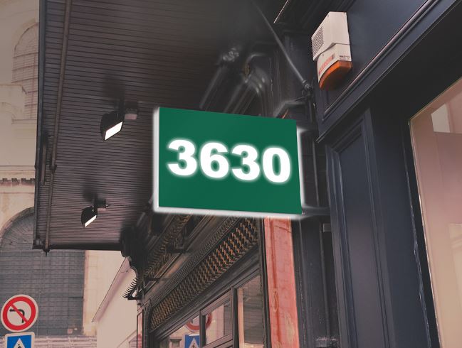 Light Kelly Green sign with the number '3630' on a building facade.