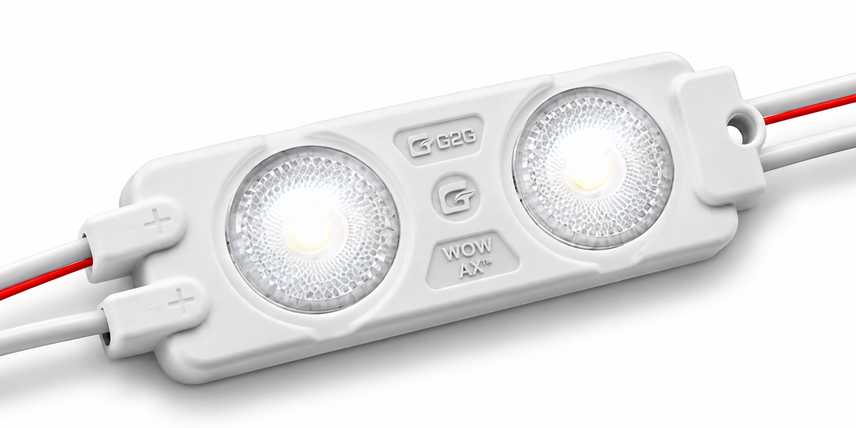 A white rectangular LED light bar with two illuminated circular LED lenses, red and white wires extending from the sides, and printed markings including 'G26' and 'WOW'.