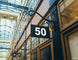 Building facade with a sign displaying the number 50