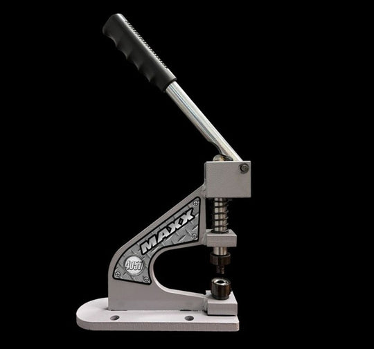 Metal tool with a lever and 'MAXX' branding on a black background