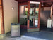 Entrance to a building with a 'Membership Center Open' sign in front.
