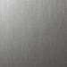A close-up of a brushed metallic surface with fine vertical texture and a silver-gray finish.
