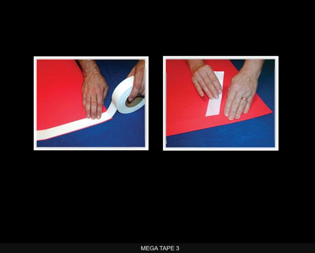 Two hands using Mega Tape on a red and blue surface.
