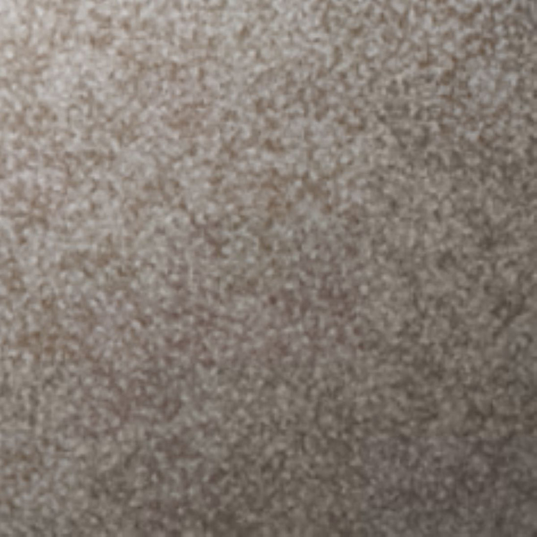 Close-up of a textured beige carpet