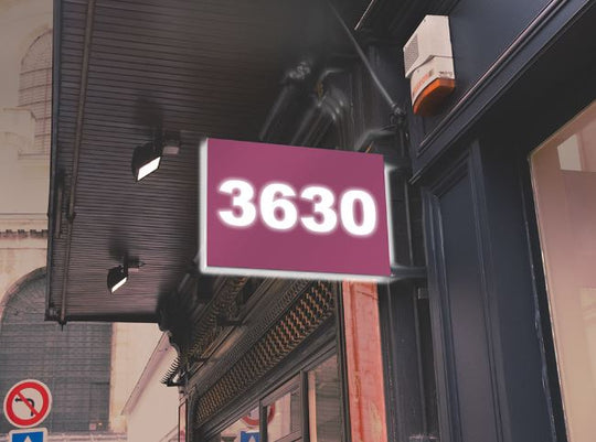 Digital display showing the number '3630' on a building exterior.