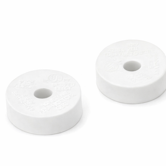 Two white circular foam filters on a white background