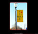 Yellow 'Welcome to Holt' banner on a streetlight against a clear blue sky.