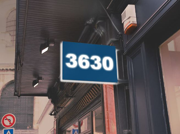 Building facade with a sign displaying the number '3630'.