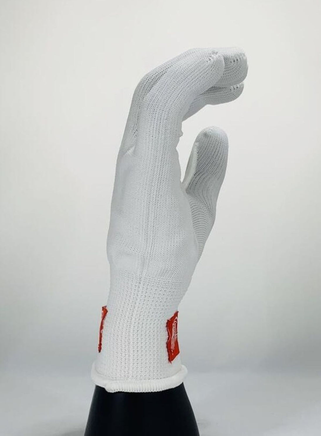 White glove with red logo on a white background
