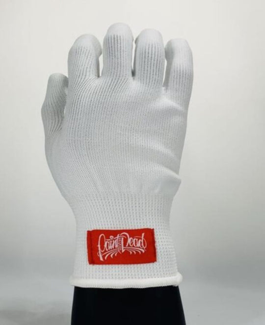 White glove with a red label on a light gray background