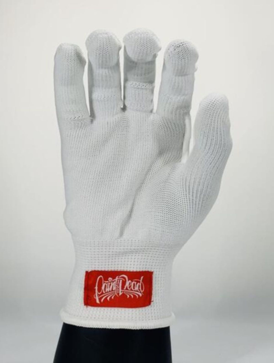 White glove with a red label on a white background