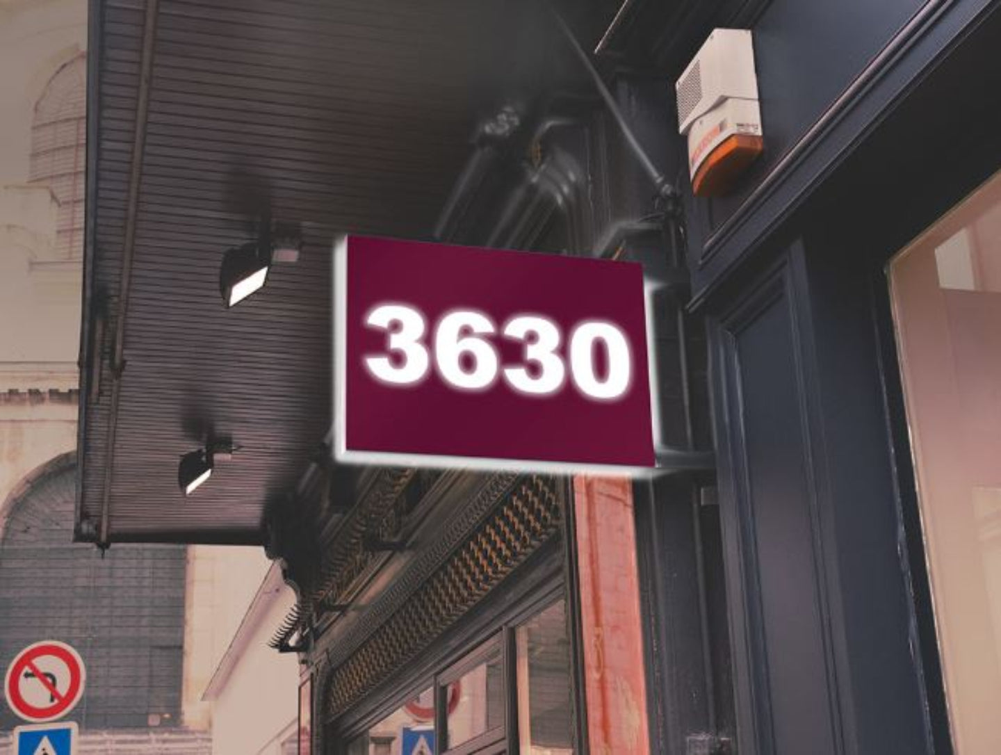Building facade with a red sign displaying the number '3630'.