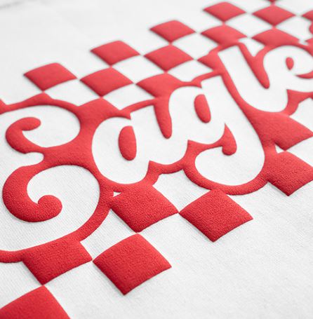 Close-up of a red and white checkered pattern with 'Google' branding.