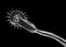 Metal prong tool on a black background