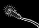 Metal prong tool on a black background