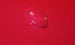 Water droplet on a red surface