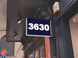 Digital display with the number '3630' on a building exterior.