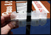 Clear plastic tool held by a hand with a blurred background