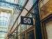Building facade with number 50 sign in an indoor setting