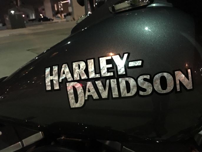Harley-Davidson logo on a motorcycle at night