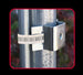 Metal bracket attached to a cylindrical metal post with a blurred natural background