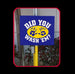 Blue sign with yellow circle and paw prints on a pole against a tiled wall background