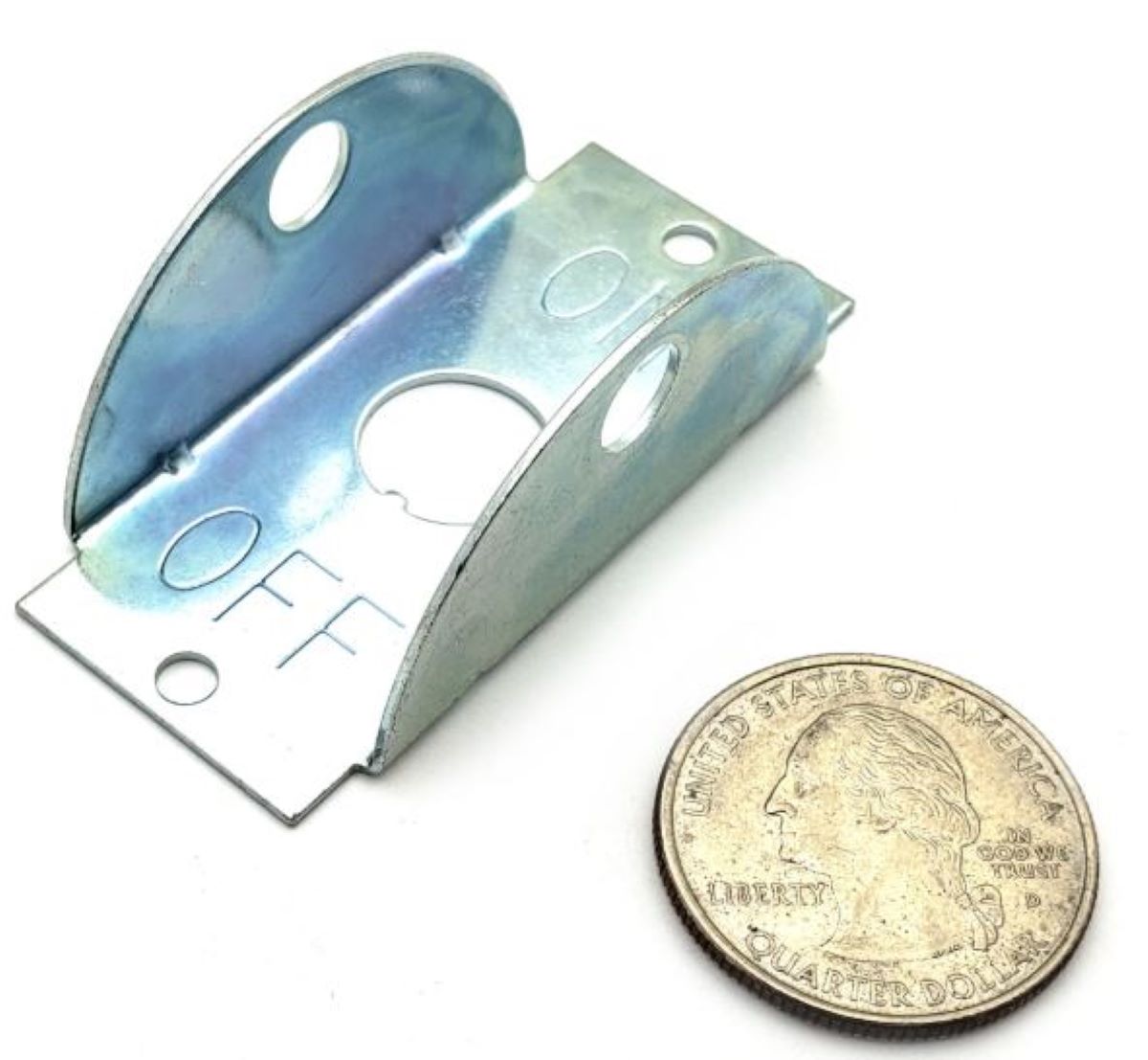 Metal bracket next to a quarter on a white background