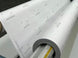ORAGUARD 290 premium cast overlaminate loaded on a laminator showing the branded release liner
