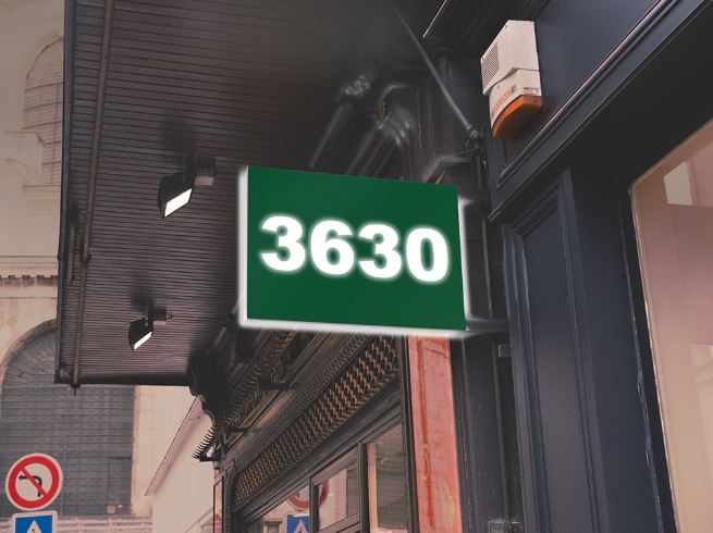 Vivid Green sign with the number '3630' on a building facade.