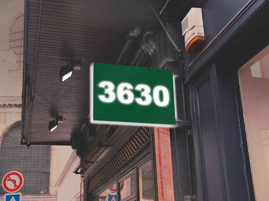 Vivid Green sign with the number '3630' on a building facade.