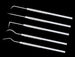 Set of dental tools on a black background