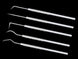 Set of dental tools on a black background