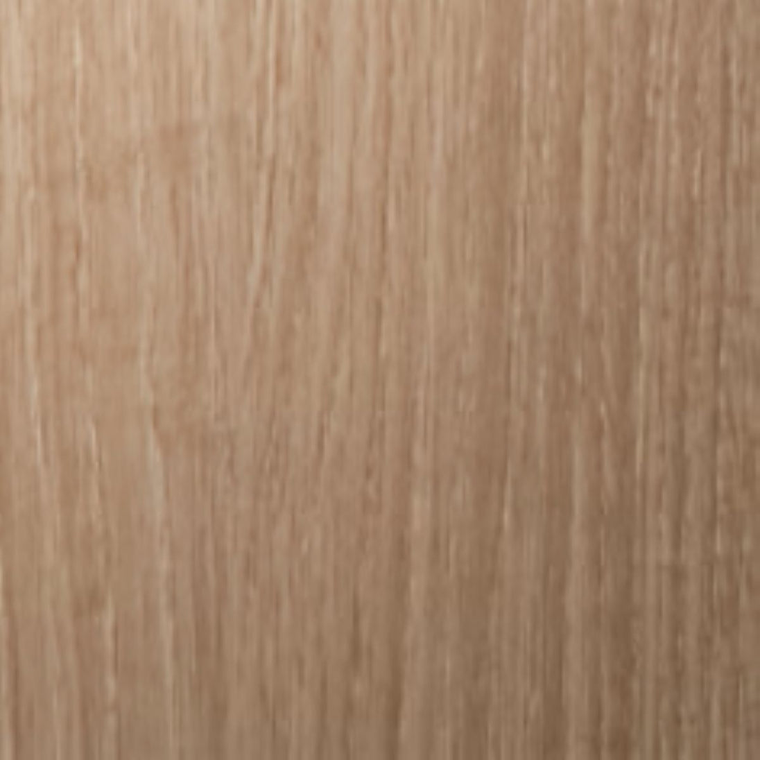 Close-up of a wooden surface with a light brown color and visible grain pattern.